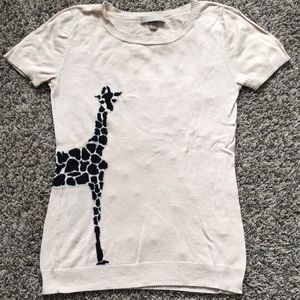 Tan shirt sleeve top with giraffe detail. Size S